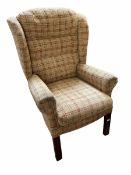 Wing back chair upholstered in beige check fabric