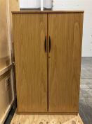 Two light oak two door office cupboards - THIS LOT IS TO BE COLLECTED BY APPOINTMENT FROM DUGGLEBY S