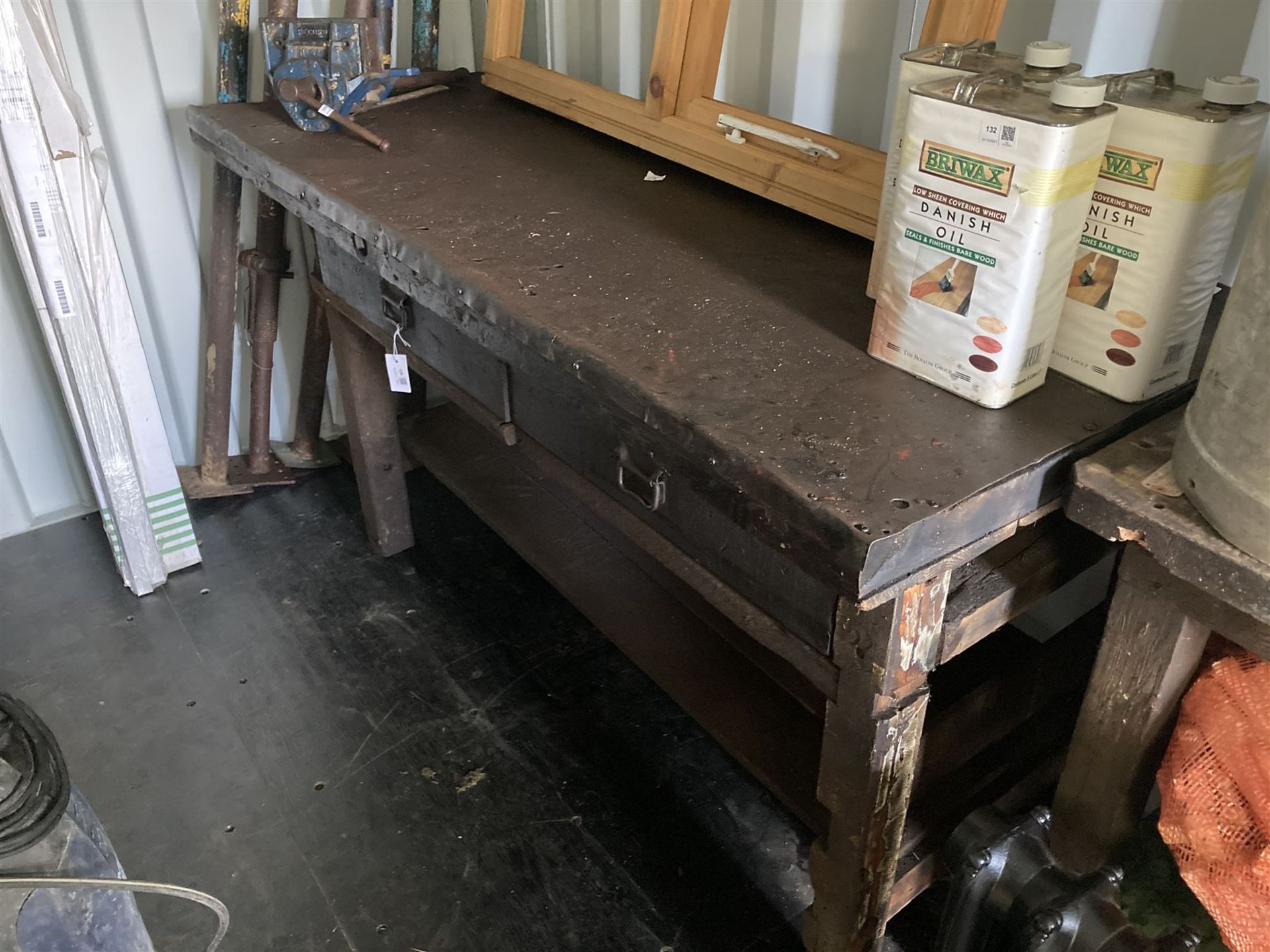 Large timber workbench with steel top