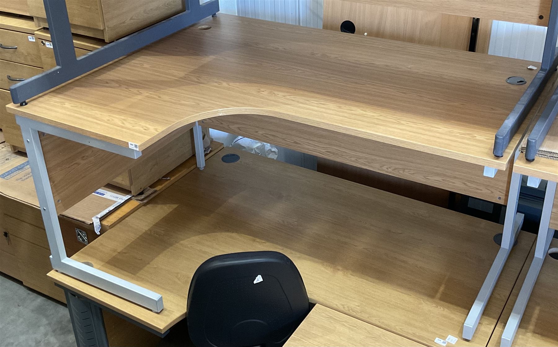 Two light oak L shaped office desks