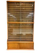 Two large floor standing die-cast model display cabinets