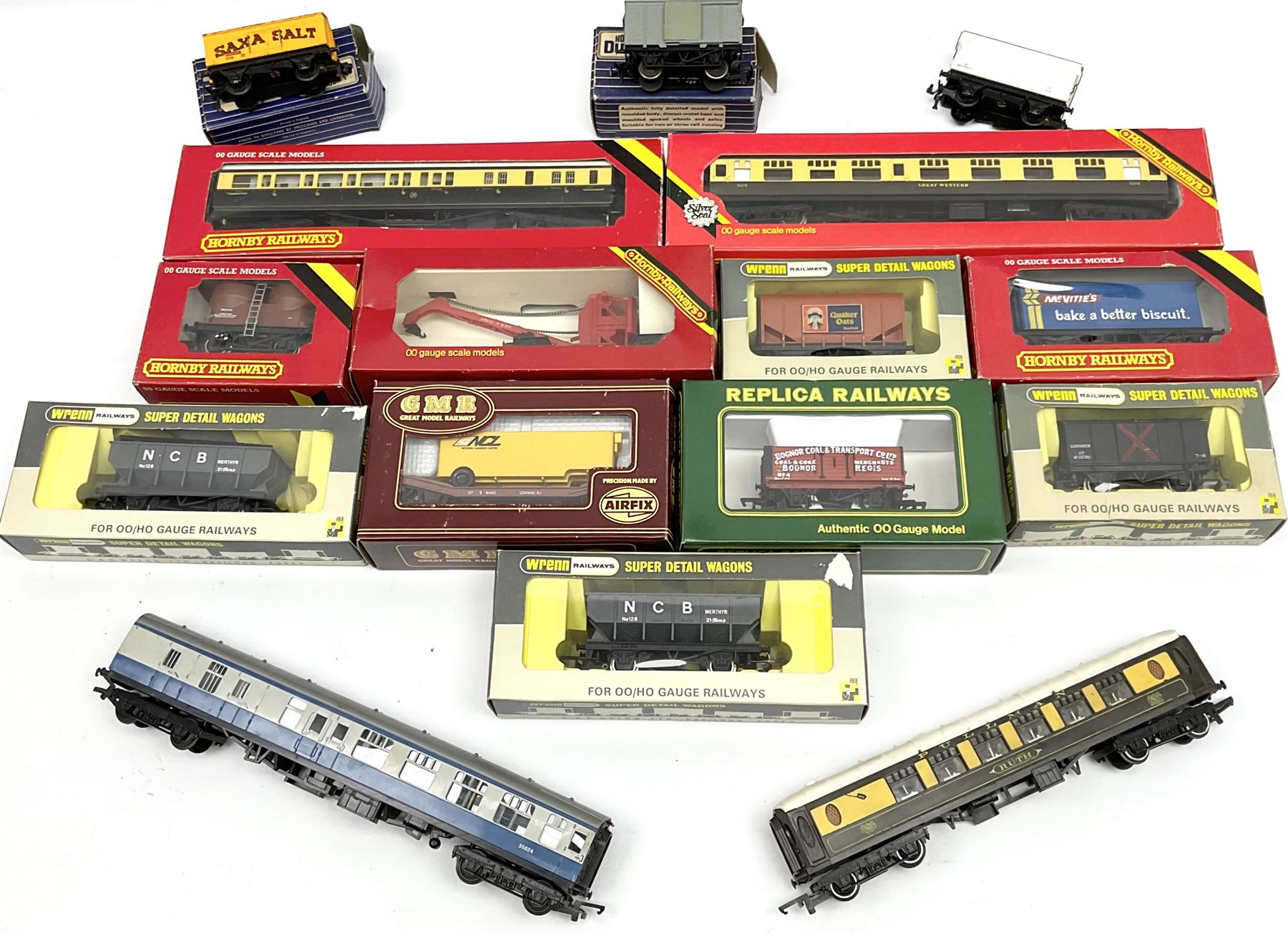 '00' gauge - four Hornby/Tri-ang passenger coaches (two boxed); and eleven goods wagons by Wrenn