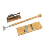 A carpet stretcher, vegetable slicer and a tobacco cutter G+