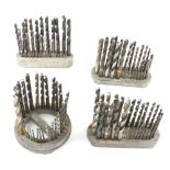Four sets of metal drill bits in orig stand G+
