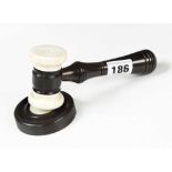 A 6" ivory and ebony gavel with matching sound block G+