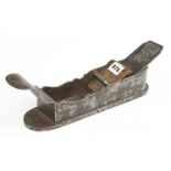 A 17/18c German iron mitre plane 11" x 3" with decoratively shaped sides and scrolled tote (