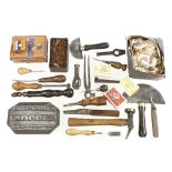 A quantity of cobblers and leather workers tools including two half moon knives, stitch wheels,