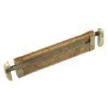 A well used 4" boxwood caliper rule unusually with two brass calipers by ROBERTS with French Lines