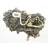 An unusual and little used 30 metre measuring chain the brass handles and tallies marked RABONE