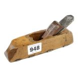 An unusual 18c miniature European fruitwood scrub plane with wear strips to the sole and