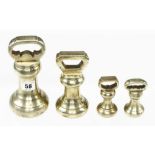 Four brass bell weights 2 x 1 lb, 4 lb and 7 lb G+