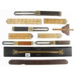 An ebony and brass rolling rule, four sliding bevels and four boxwood rules etc G+