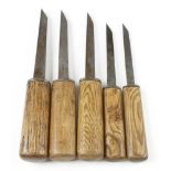 A graduated set of four mortice chisels by ISAAC GREAVES and another 1/8" to 9/16" G+
