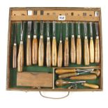 A set of 14 ADDIS carving tools and six other tools and a sharpening stone in craftsman made box G+