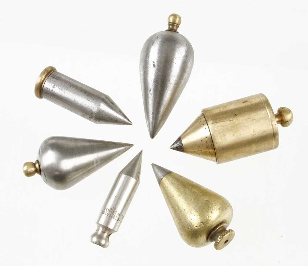 Four steel and two brass plumb bobs G+