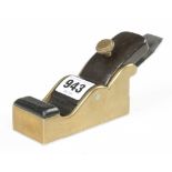 A steel soled gunmetal chariot plane 4" x 1 3/4" with rosewood infill and elongated wedge and