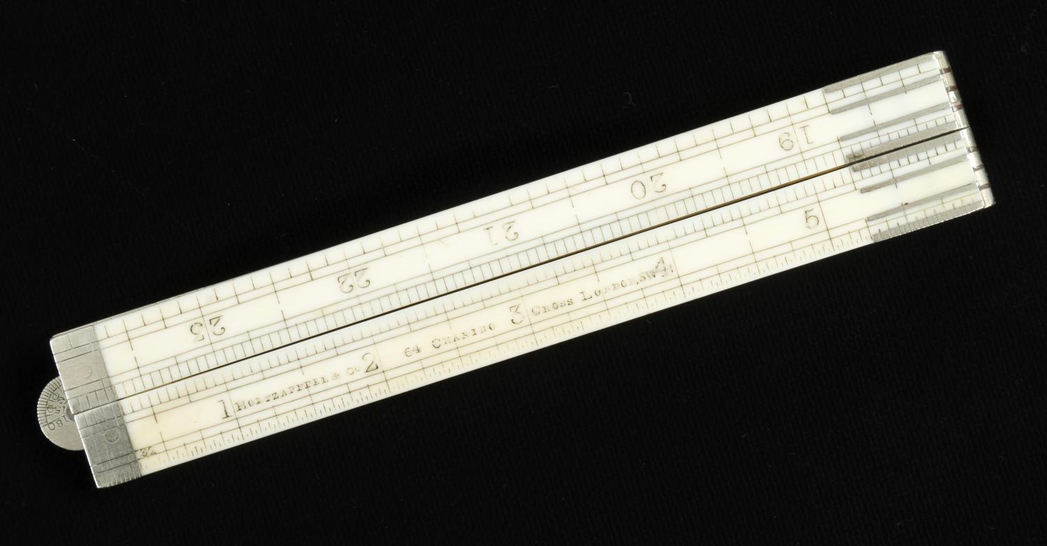 A 2' four fold ivory rule by HOLTZAPFFEL & Co with protractor hinge and inside bevel edges G+