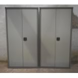 Two double door steel cupboards with shelving