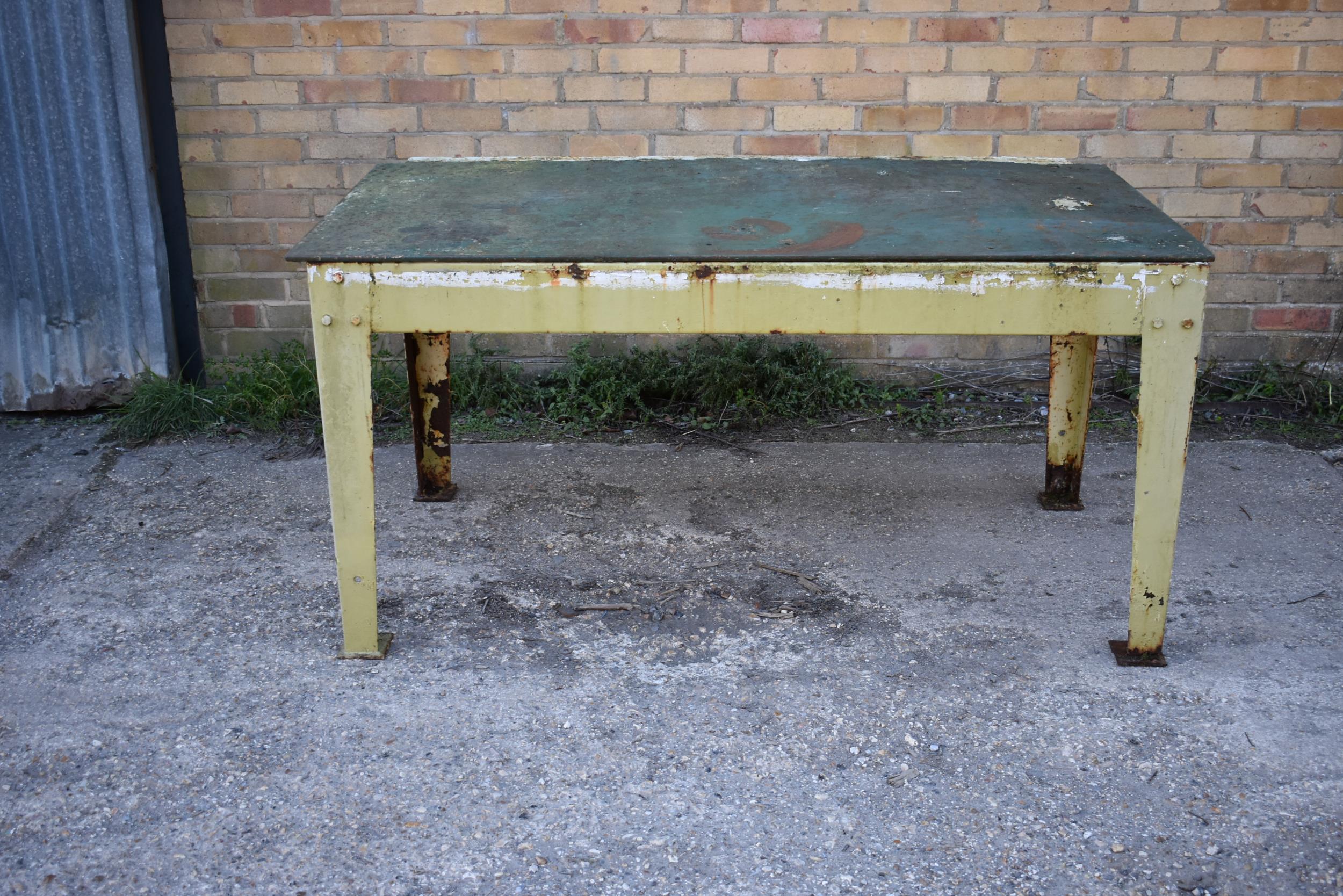 A heavy duty metal table/bench 62" x 34"