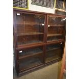 A glazed display unit 6' x 6' x 18" with sliding doors and adjustable shelves
