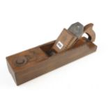 A handled European cormierwood cornice plane 15" x 3 3/4" with orig iron, the top and edges carved