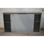 A metal cupboard with sliding doors