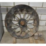 A heavy vintage spoked lift shaft wheel