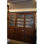 An impressive glazed antique pine display unit 7'8" x 7'6" x 2' with shelves and drawers