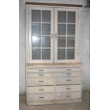 A large pine glazed bookcase/plan chest