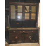 A large antique pine dresser with glazed doors for restoration