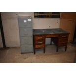 A 4 door filing cabinet and an oak office desk