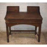 A clerk's antique desk with woodgrain finish