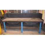 A wood work bench with cast iron legs ex Alfred Herbert