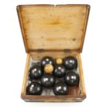 A set of 8 ebonised lignum bowls and two jacks in orig pine box with Association Set Regulation