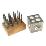 A steel doming block in orig box and 12 dome punches G+