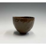 From the earliest days of the Leach Pottery, St Ives A tea bowl on a clay squashed roll foot