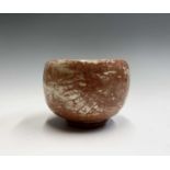 From the earliest days of the Leach Pottery, St Ives A Raku tea bowl on a clay squashed roll foot