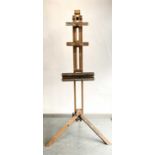 A mahogany artists studio easel on tripod base.Condition report: No woodworm. Stable. Splashed