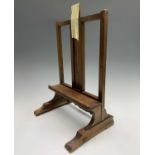 A mahogany tabletop easel in Georgian style together with two modern tabletop easels.Condition