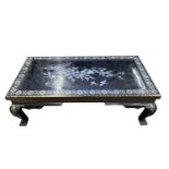 A Chinese black lacquer and mother of pearl inlaid low table, late 20th century, with two drawers,