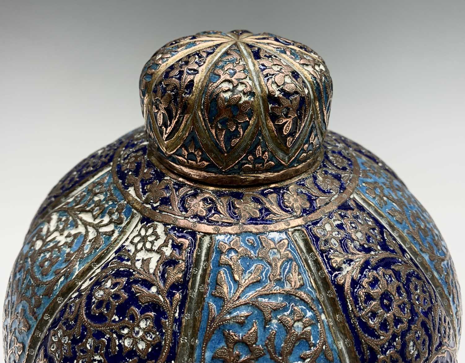 A Persian enamelled copper vase and cover, 19th century, the navy and sky blue panels each enclosing - Image 2 of 9