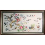 A Chinese silk embroidered picture, 20th century, with a tree and multiple colourful exotic birds,