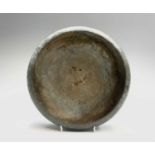 A Japanese bronze censor, early 20th century, of circular form with three slightly raised bun