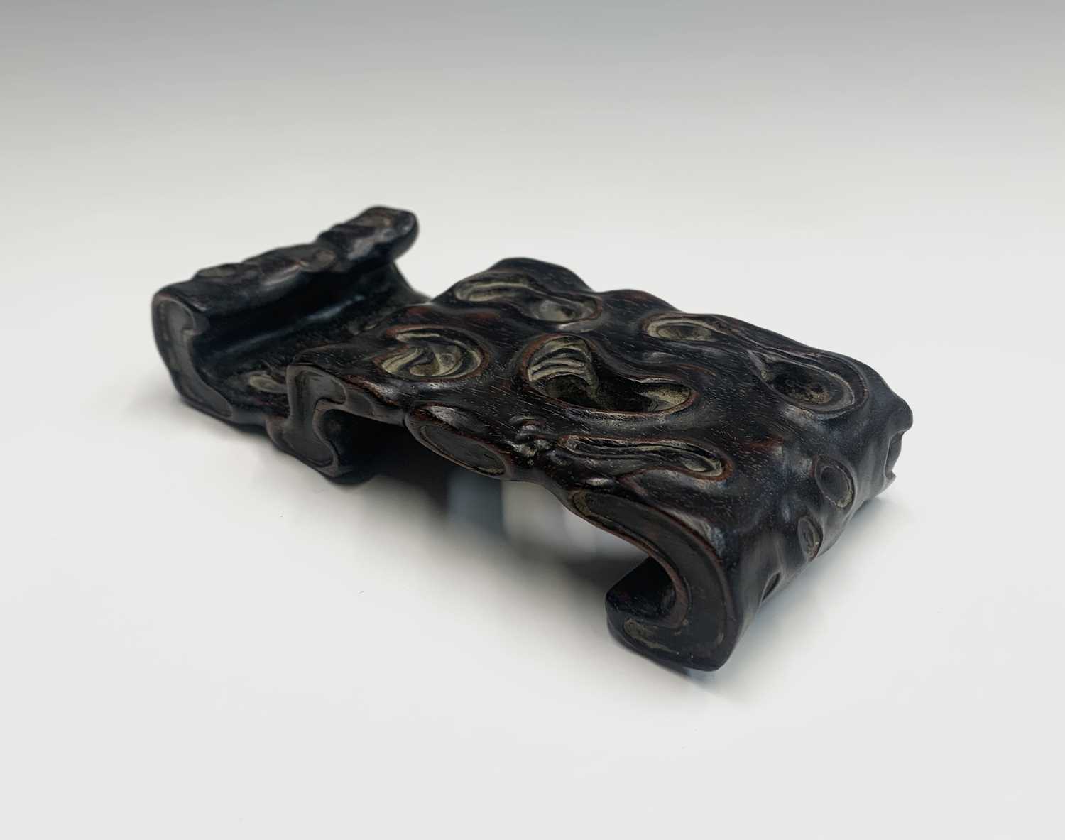 A Chinese Zitan wood carved brush stand, 18th century, height 2.5cm, width 14cm, depth 6.3cm.