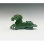 A Chinese hardstone model of a horse, height 6.5cm, width 11cm.
