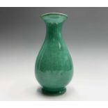 A Chinese green crackle glazed earthenware vase, of baluster form, height 27.5cm, width 14cm.