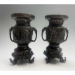 A pair of Japanese bronze vases on stands, Meiji Period, six character seal, height 24.5cm.