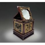 A Chinese hardwood and giltwood carved table cabinet, circa 1900, the hinged cover opening to reveal