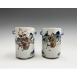 A pair of Chinese famille verte cylindrical jars, 19th century, lacking covers, with warriors on