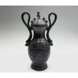 A Chinese bronze archaic style vase, circa 1900, with serpent handles flanking rows of